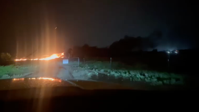 A powerful lightning strike ignites a gas tank explosion in Springtown, Texas, Saturday night, April 25, sparking a large fire.