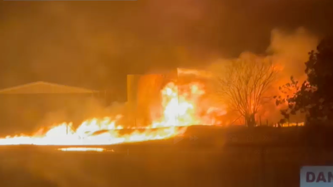 A powerful lightning strike ignites a gas tank explosion in Springtown, Texas, Saturday night, April 25, sparking a large fire.