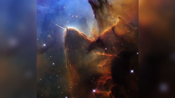 NASA's Hubble Telescope captures images of the Trifid Nebula.