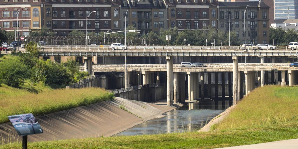 Search for woman swept away by waters in Houston suspended after no luck, officials say