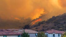 Thousands of acres charred across the US as wildfires sweep the Plains, California with evacuations underway
