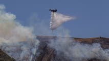Firefighters gain ground on wildfires that charred thousands of acres, forced evacuations across the US