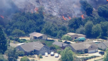 Mandatory evacs underway as wildfire threatens several homes and structures in Southern California