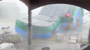 Look out: Powerful winds send bounce house tumbling through yard and into SUV in Florida