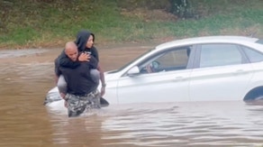Piggybacked to safety: Good Samaritan carries stranded driver through Atlanta floodwater