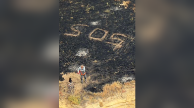 Sailor rescued in the knick of time as massive, record-breaking wildfire engulfs California island
