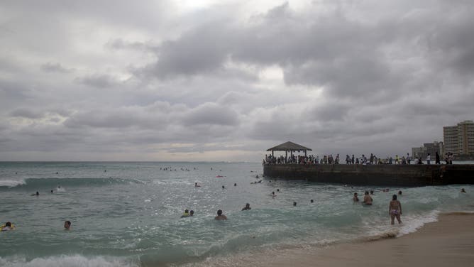 HONOLULU, HI - AUGUST 24: Both locals and visitors alike ignored Mayor Kirk Caldwell's order to stay out of the ocean due to dangerous conditions caused by hurricane Lane on the East end of Waikiki on August 24, 2018.