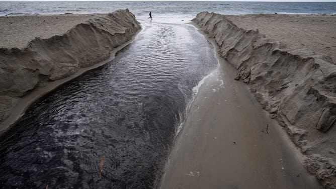 LAGUNA BEACH, CA - NOVEMBER 29: Storm water runs into the ocean at Main Beach in Laguna Beach, CA on Thursday, November 29, 2018.
