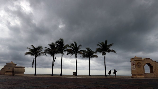 Afternoon thunder clouds roll onto the shore in Hollywood, Florida, in July 2021.