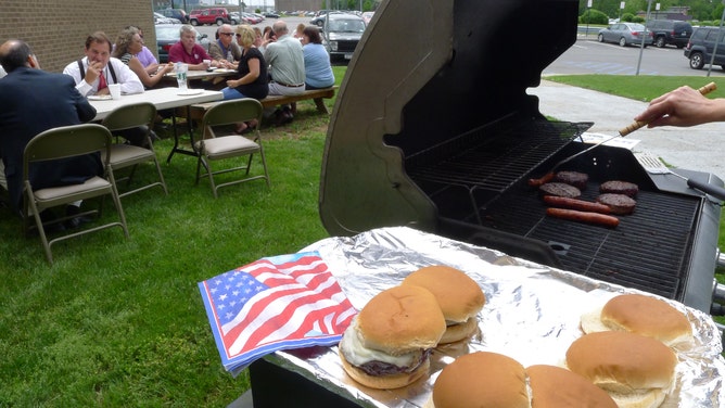 Employees at the Albany International Airport enjoy a group Memorial Day hoilday themed cookout in Colonie N.Y. Friday May 25, 2012.
