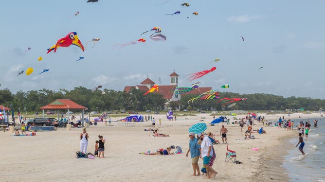 Kites flying over the man-made sand beach in Long Beach, Mississippi along the Mississippi Gulf Coast.