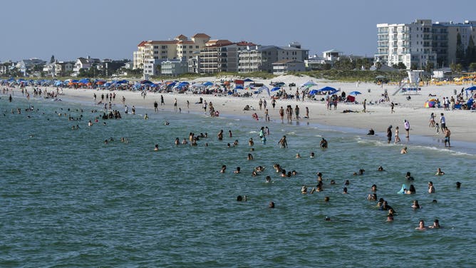 Beachgoers are on a very hot day at Clearwater Beach in Florida, USA. (