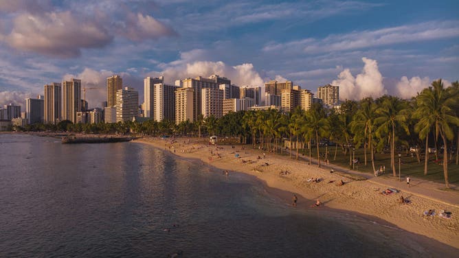 Drone view point over Honolulu, Diamond Head and Waikiki Beach and Turquoise water with skyline, Oahu, Hawaii.