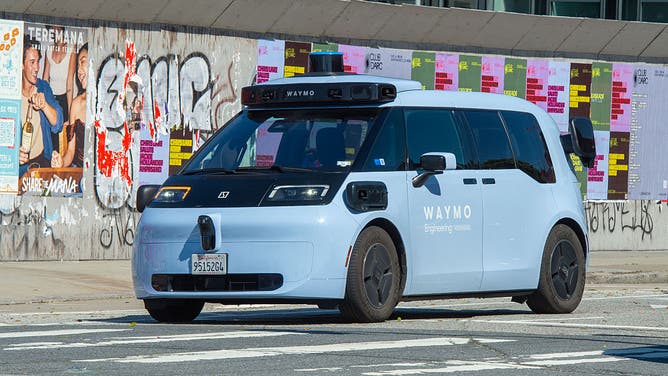06 May 2026, USA, San Francisco: A robot cab from Google's sister company Waymo is on the road. 