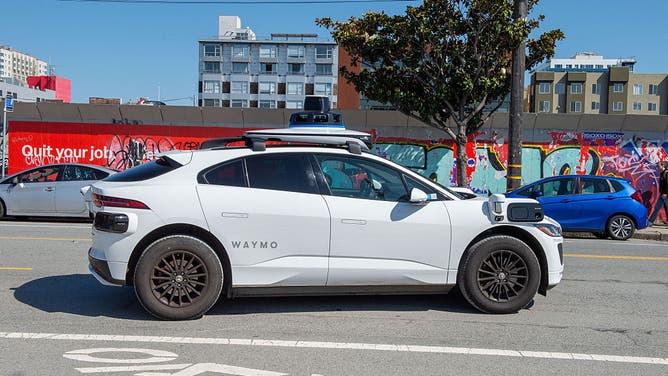 06 May 2026, USA, San Francisco: A robot cab from Google's sister company Waymo is on the road. 