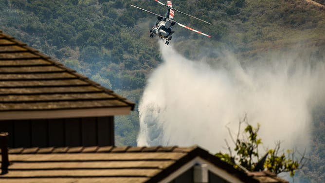 Simi Valley, CA - May 18: Water drops continue as the Sandy Fire burns nearby hillsides Rocking Horse Dr. in Simi Valley, CA on Monday, May 18, 2026.