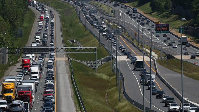 QUANTICO, VA - MAY 22: Heavy Memorial Day traffic moves southbound and northbound along I-95 May 22, 2015 in Quantico, Virginia.