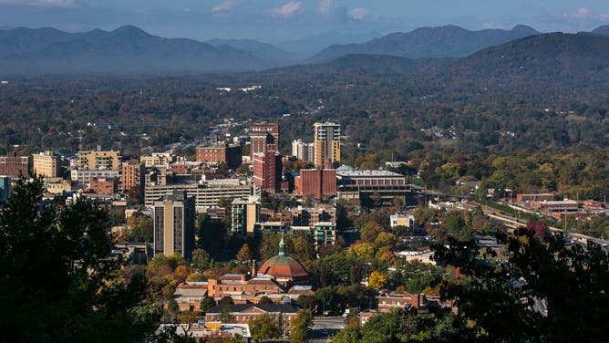 ASHEVILLE, NC - OCTOBER 20: The downtown skyline is viewed on a sunny autumn day on October 20, 2016 near Asheville, North Carolina.