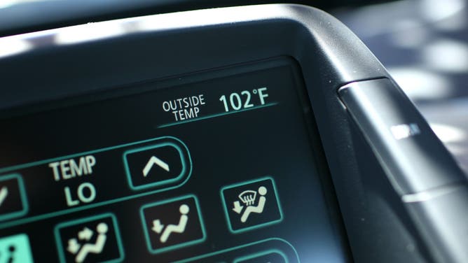 PETALUMA, CA - JUNE 20: A car thermometer displays an outside temperature of 102 degrees June 20, 2008 in Petaluma, California.