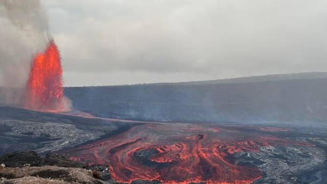 Episode 47 of lava fountaining in Halemaʻumaʻu began at the summit of Kīlauea at 3:27 p.m. HST on May 14th, 2026. This photo was taken nearly three hours later, at 6:18 p.m., from the south rim of the crater, and shows the north vent lava fountain (left) feeding lava flows that are advancing across the crater floor.