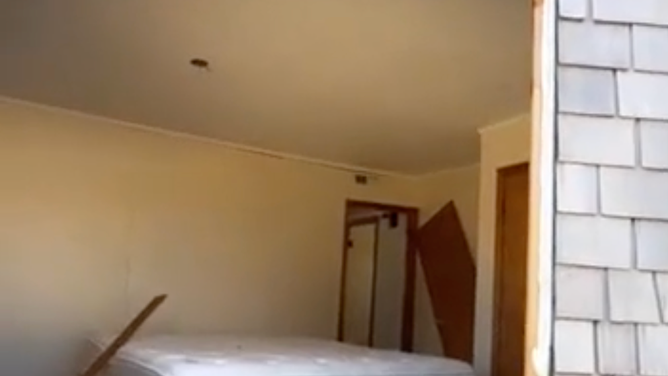 A mattress in a bedroom within the house. 