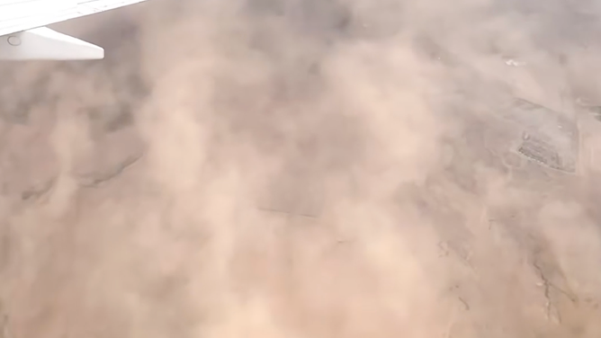 The dust hid the ground below.