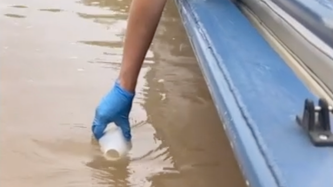The Chattahoochee RIverkeeper collecting a water sample from the river on May 22, 2026.