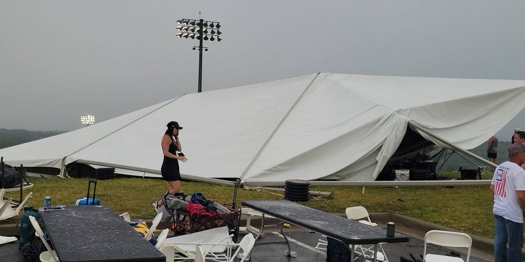 Five injured after ferocious winds and severe storms rip through college baseball game, sending tents airborne