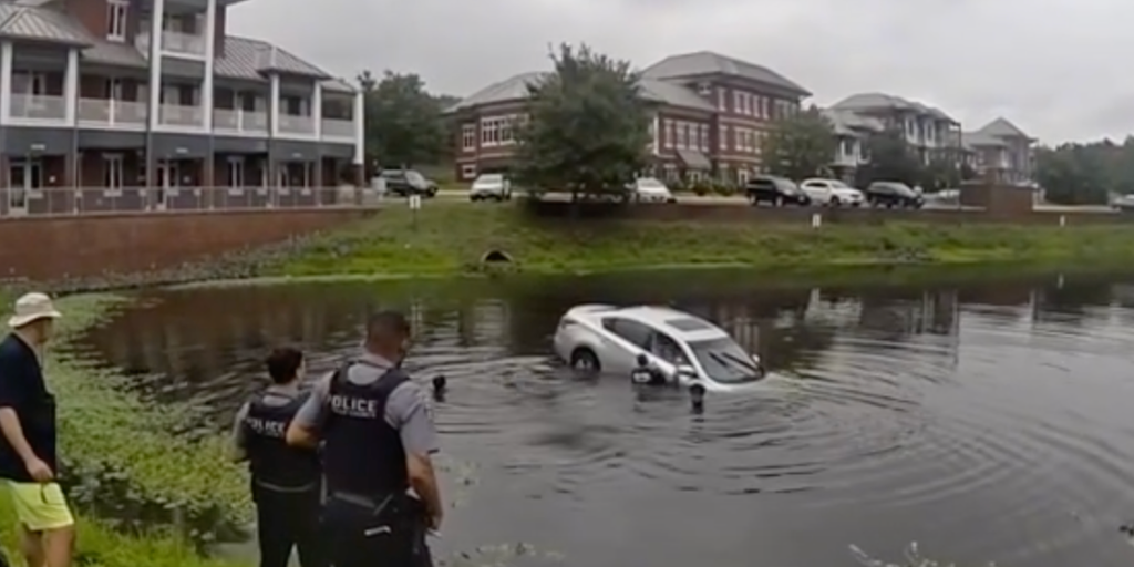 Watch: First responders form human chain to rescue trapped driver from sinking vehicle in Virginia