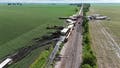 Drone video captures double-stack train cars toppled over after destructive winds tore through Illinois - Fox News