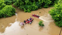See it: Firefighters use rescue boats to save 15 campers stranded in fast-rising floodwaters