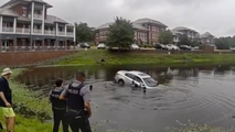 Watch: First responders form human chain to rescue trapped driver from sinking vehicle in Virginia