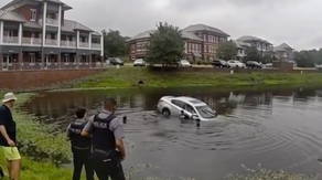 Watch: First responders form human chain to rescue trapped driver from sinking vehicle in Virginia
