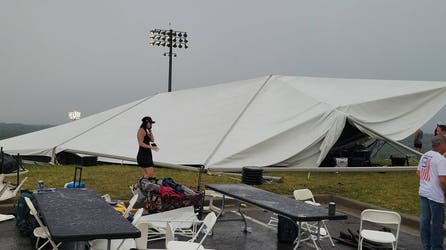 Five injured after ferocious winds and severe storms rip through college baseball game, sending tents airborne