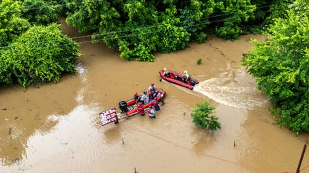 See it: Firefighters use rescue boats to save 15 campers stranded in fast-rising floodwaters