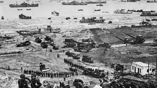 Picture taken on June 6, 1944 in Normandy showing the Allied forces soldiers involved in the landing operation aimed at fighting the German Wehrmacht as part of the Second World War.