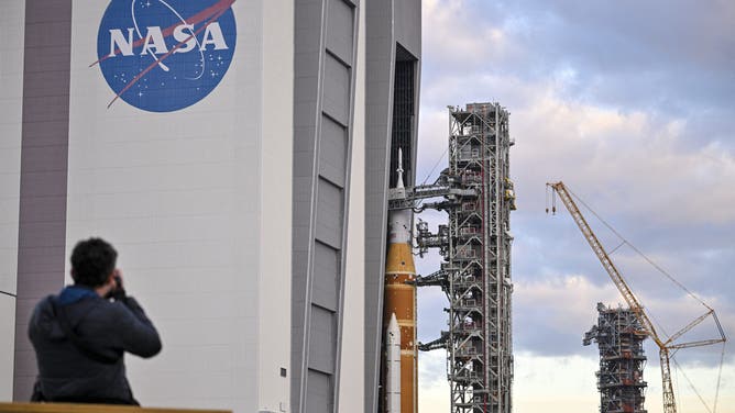 NASA's Artemis II Space Launch System rocket and Orion spacecraft are rolled out of the Vehicle Assembly Building to Launch Pad 39B at Kennedy Space Center in Florida on January 17, 2026, ahead of the crewed lunar mission.