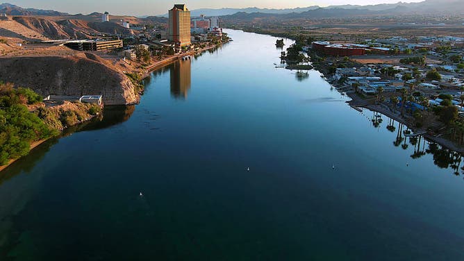 The Colorado River flows past Laughlin, Nevada, left, and Bullhead City, Arizona, on May 12, 2023. 