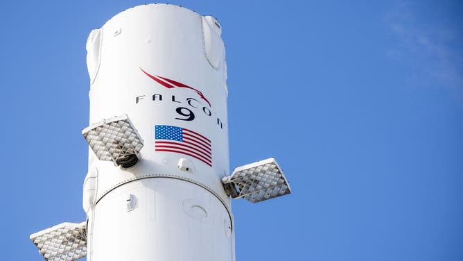 A SpaceX Falcon 9 reusable rocket booster on display outside the company's facilities in Hawthorne, California, US, on Monday, April 13, 2026. SpaceX has filed confidentially for an initial public offering, according to people familiar with the matter, bringing billionaire Elon Musk's rocket, satellite and AI company closer to delivering the biggest-ever listing.