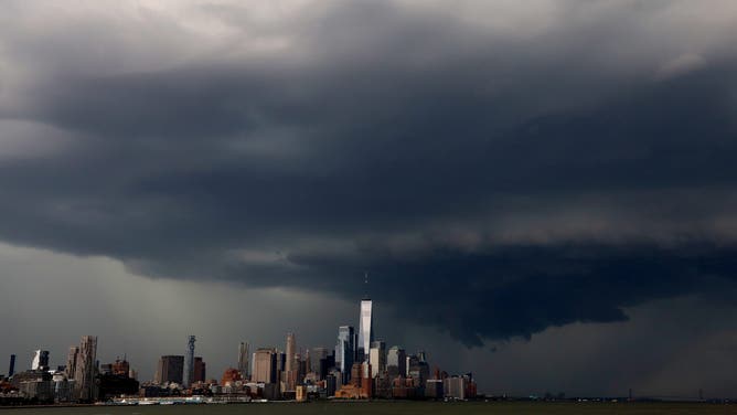 HOBOKEN, NJ - MAY 20 A thunderstorm passes over the skyline of lower Manhattan and One World Trade Center in New York City on May 20, 2026, as seen from Hoboken, New Jersey.