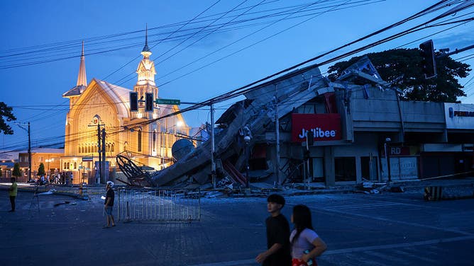 GENERAL SANTOS, PHILIPPINES - JUNE 8: A collapsed Jollibee fast food restaurant next to a church, following a magnitude 7.8 earthquake that struck the Southern Philippines, in General Santos city, Philippines, on June 8, 2026.