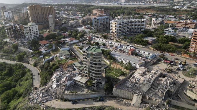 This aerial view shows collapsed buildings in Catia La Mar, La Guaira state, Venezuela, on June 27, 2026, following earthquakes that struck the region.