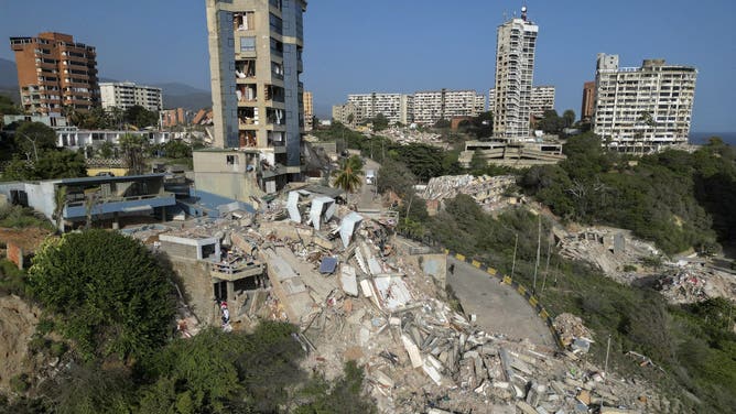 This aerial view shows collapsed buildings in Catia La Mar, La Guaira state, Venezuela, on June 27, 2026, following earthquakes that struck the region.