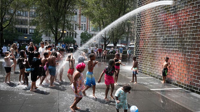 CHICAGO, ILLINOIS - JUNE 29: People cool off at Crown Fountain in Millennium Park as temperatures topped 90 degrees on June 29, 2026 in Chicago, Illinois. 