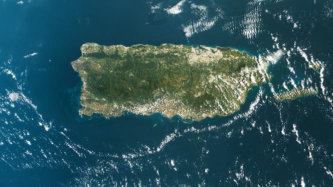 An astronaut aboard the International Space Station captured this broad view of Puerto Rico, where lush green terrain gives way to a drier southern coast, on April 6, 2024.