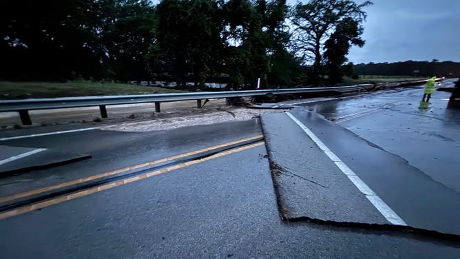 Texas flooding causes significant damage to the roadway in the Sisterdale area on Monday.