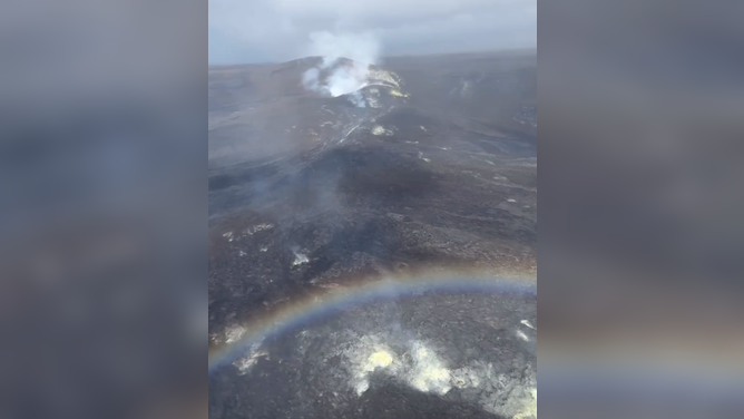 A rainbow is seen as Hawaii’s Kīlauea volcano nears 50th episode