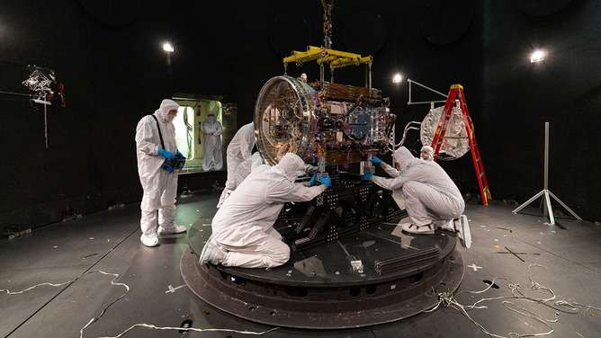 Katalyst engineers work on the LINK satellite.