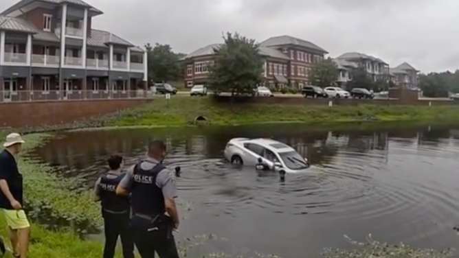 First responders rescue trapped driver from sinking vehicle in Fairfax County, Virginia, Sunday, June 28
