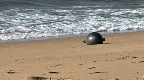 Photos: Mysterious metallic spheres washing up on Australian beach identified